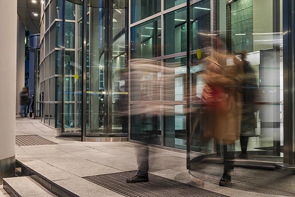 Identity and Access Assessment Image - lady walking through entrance of office block